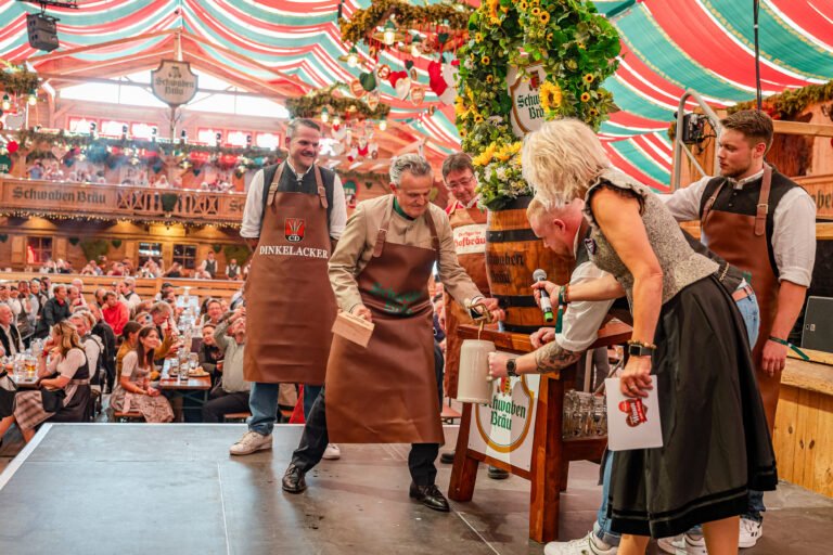 The mayor of Stuttgart taps the keg to open the Stuttgarter Volksfest